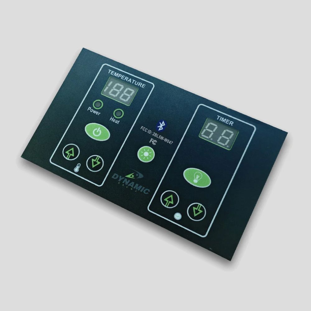 Control panel with digital display and buttons on a gray background