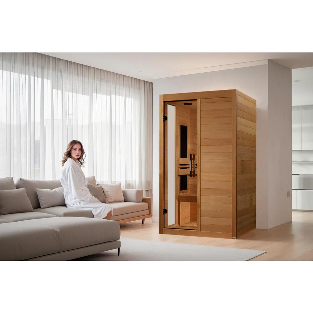 Woman in a white robe standing in a modern living room with a wooden sauna.