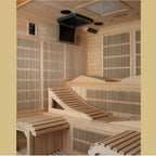 Wooden sauna with benches and a television mounted on the wall.