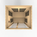 Sauna interior with wooden walls and ceiling, white floor, and black heating elements.
