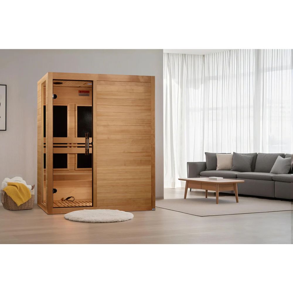 Wooden sauna in a modern living room with a gray sofa and coffee table.