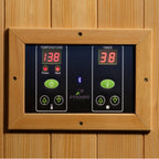 Digital control panel with temperature and timer display on a wooden background