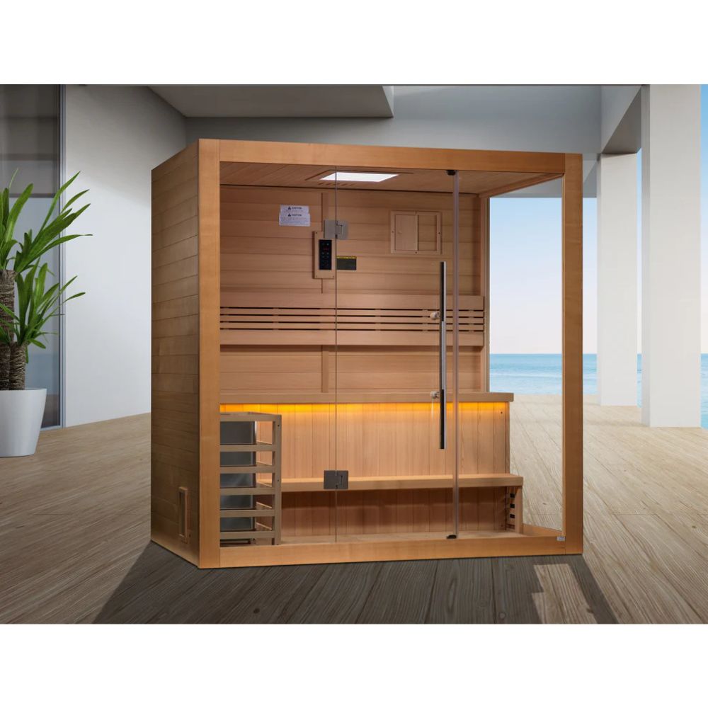 Wooden sauna with interior lights in a modern room with a view of the ocean.
