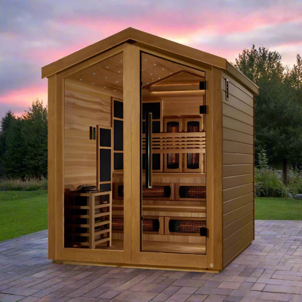 Wooden sauna with a sunset sky and trees in the background
