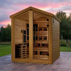 Wooden sauna with a sunset sky and trees in the background