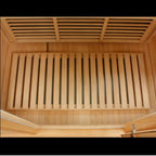 Wooden sauna interior with slatted ceiling and bench