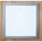 Square light fixture with silver frame on a wooden background