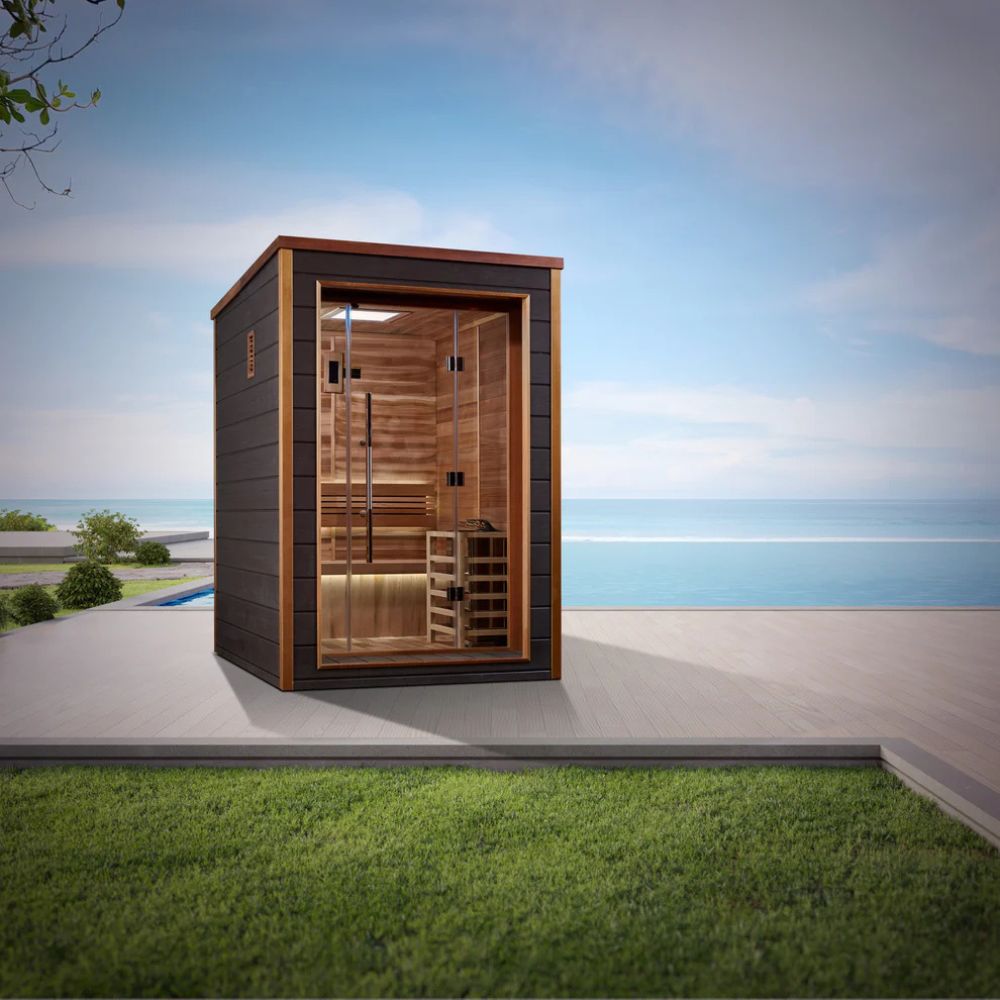 Wooden outdoor cabinet with glass doors on a grassy area by the ocean
