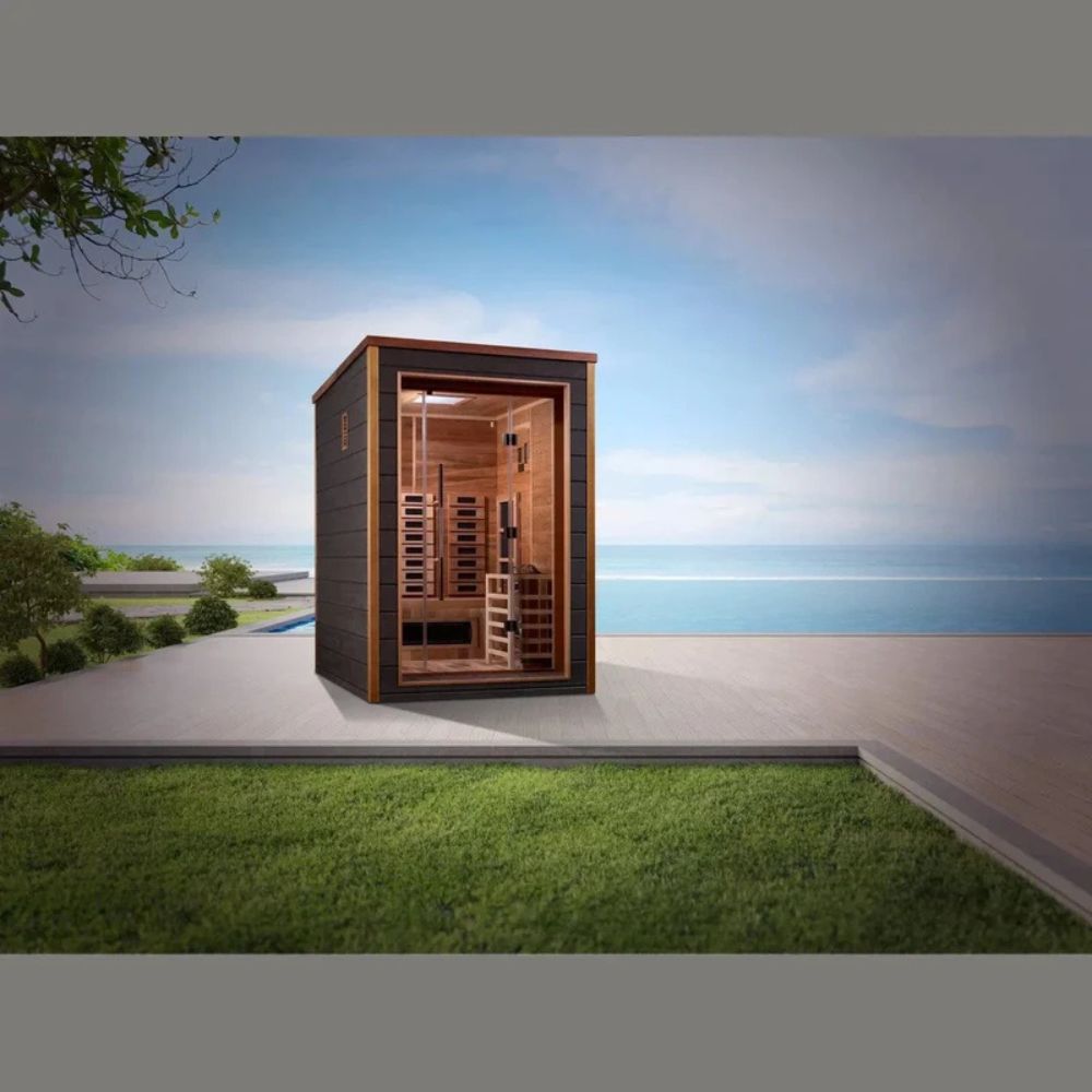 Wooden sauna structure on a grassy area with a scenic background