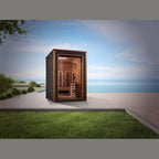 Wooden sauna structure on a grassy area with a scenic background