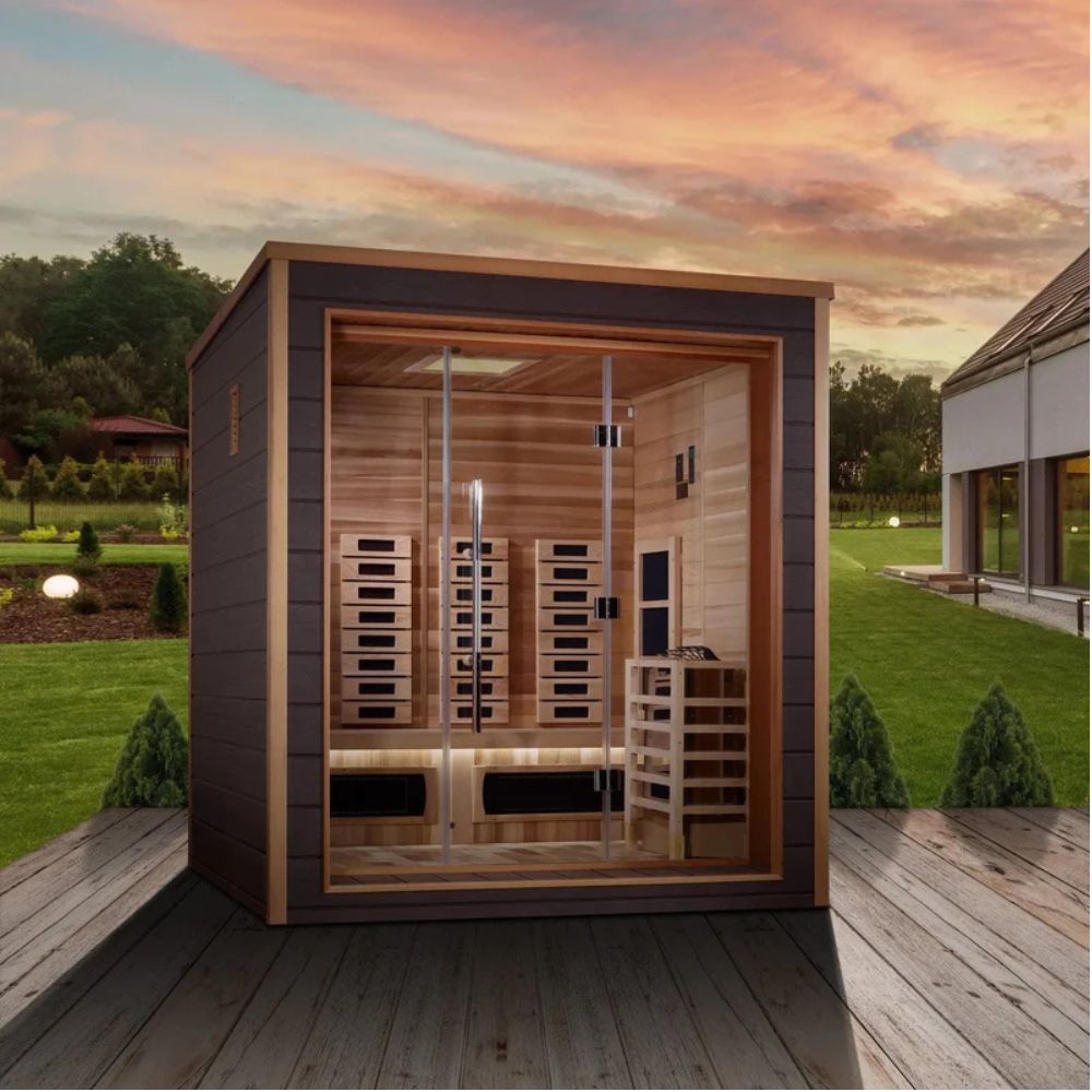 Wooden sauna on a wooden deck with a scenic background
