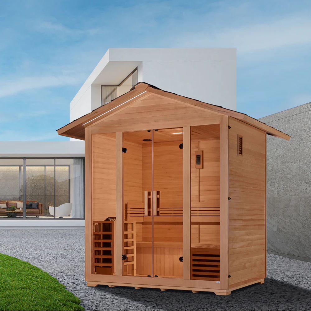 Wooden outdoor sauna with modern house in the background