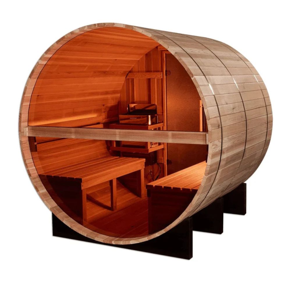Wooden barrel sauna with interior benches on a white background