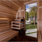Wooden sauna with a view of a garden and pool area outside