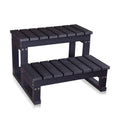 Black wooden step stool with two levels on a white background