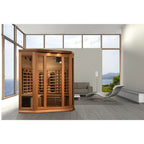 Wooden sauna in a modern living room with large windows and a view of mountains.