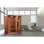 Wooden sauna in a modern room with large windows and a view of the ocean.