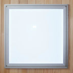 Square light fixture with metallic frame on a wooden background