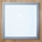 Square light fixture with metallic frame on a wooden background