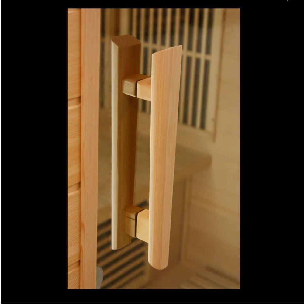 Wooden handle on a glass door with a blurred background