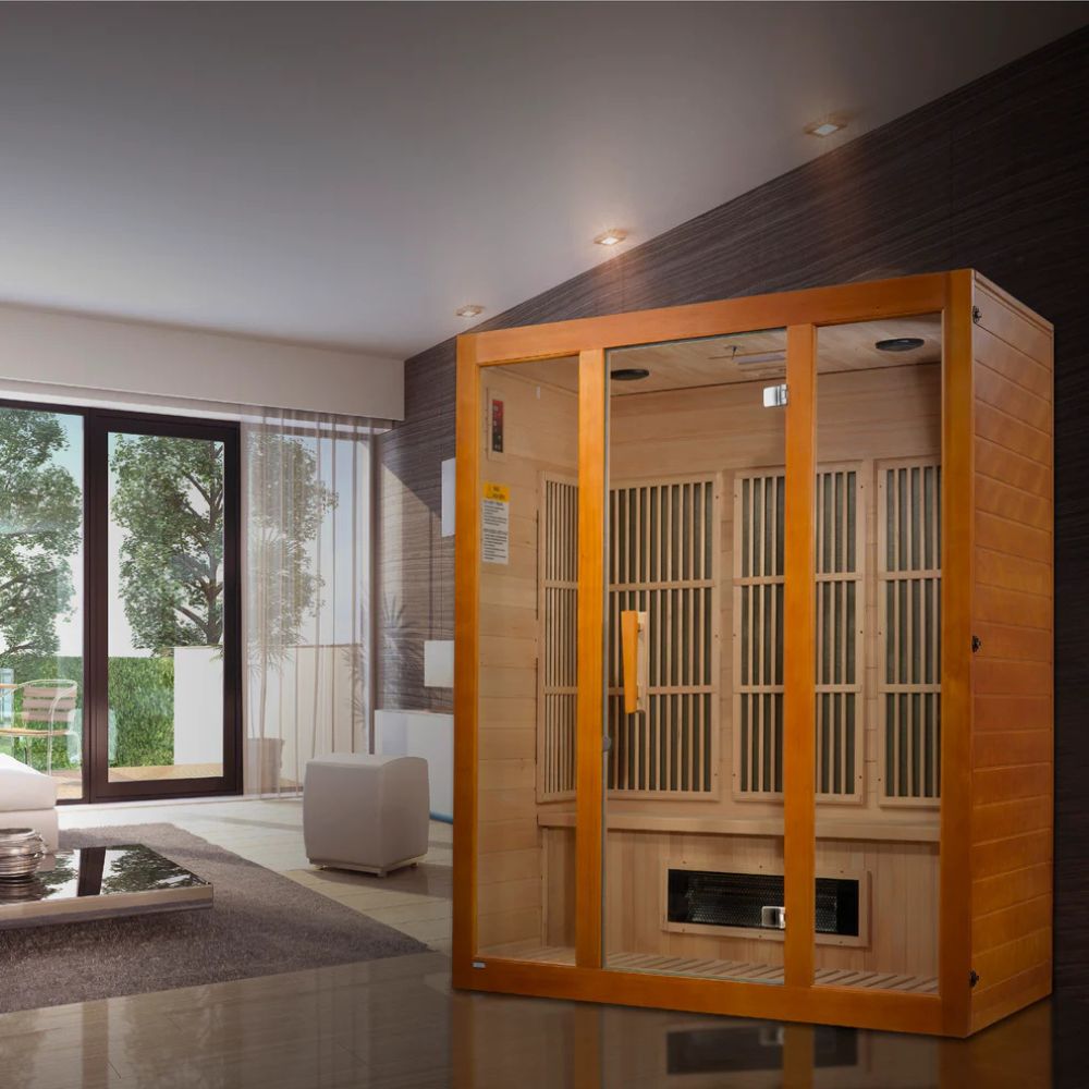 Wooden sauna room in a modern living space with large windows.