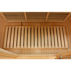 Wooden sauna interior with bench and ceiling vents on a white background