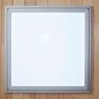 Square light fixture with silver frame on a wooden background