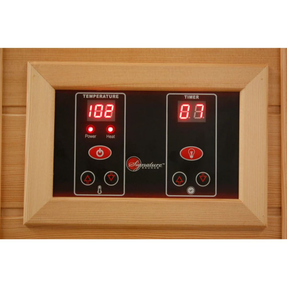 Digital control panel with temperature and timer display on a wooden background