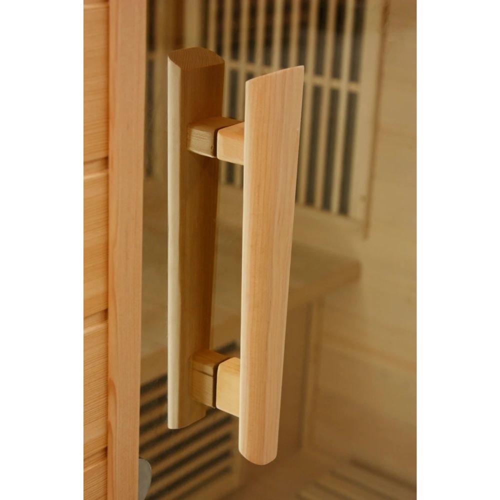 Wooden handle on a wooden door with a blurred background