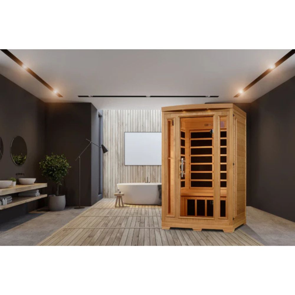 Wooden sauna in a modern room with dark walls and a bathtub.