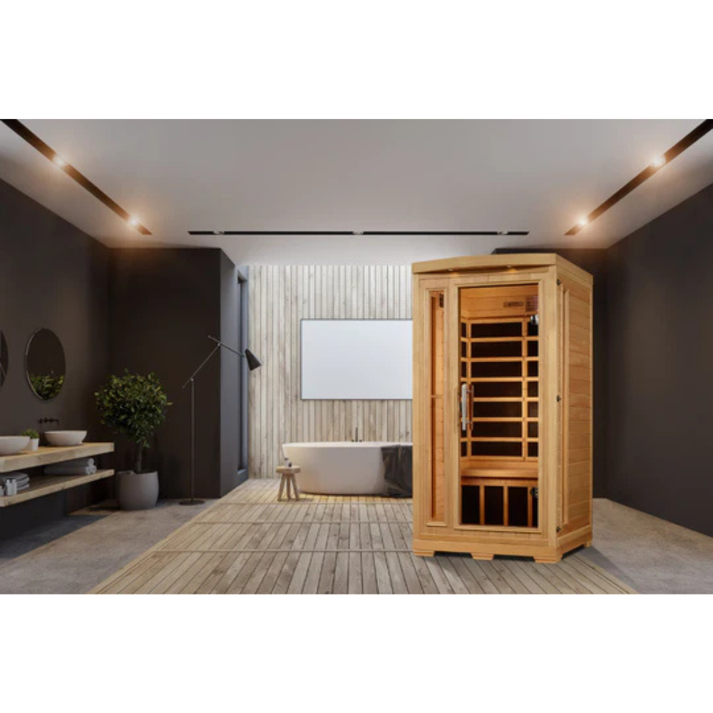 Infrared sauna in a modern room with dark walls and wooden floor.