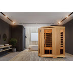 Wooden sauna in a modern room with gray walls and a rug.